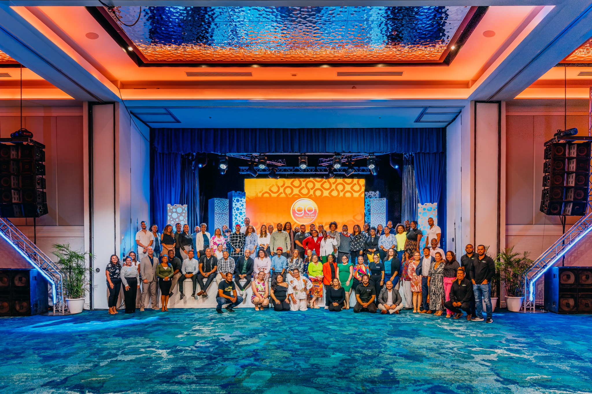 CreActivo participants gathered for a group photograph on stage